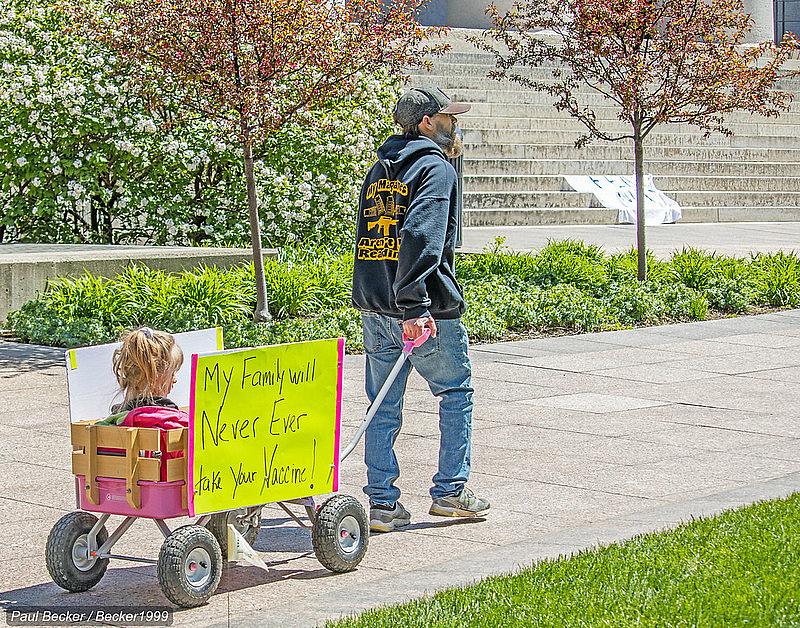 A man pulls a wagon at an “Open Ohio” protest rally in front of the statehouse this spring.