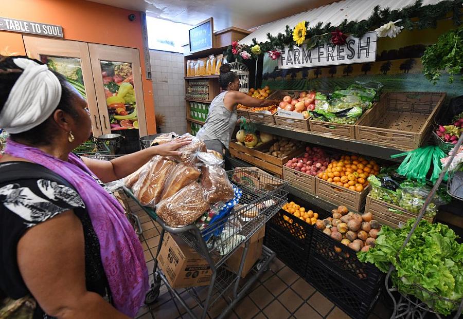 People on low-incomes and retirees buy food at the World Harvest Food Bank in Los Angeles.