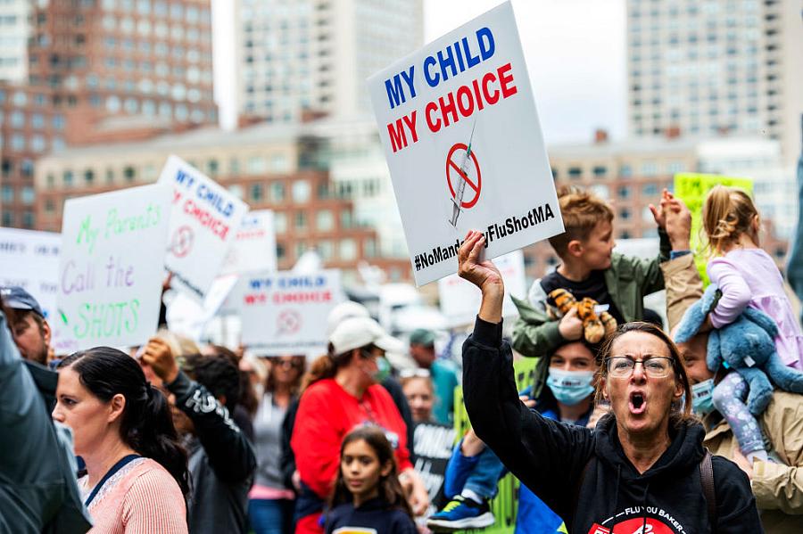 Demonstrators protest a flu vaccine order for children outside the John Joseph Moakley United States Federal Courthouse in Bosto