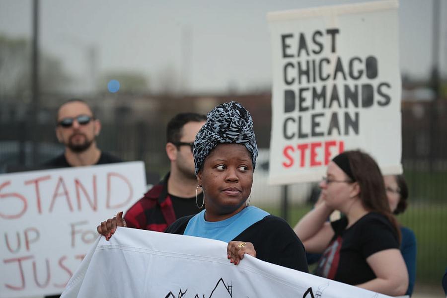 Environmental activists protest outside a Chicago elementary school closed in 2016 after high levels of lead and arsenic were fo