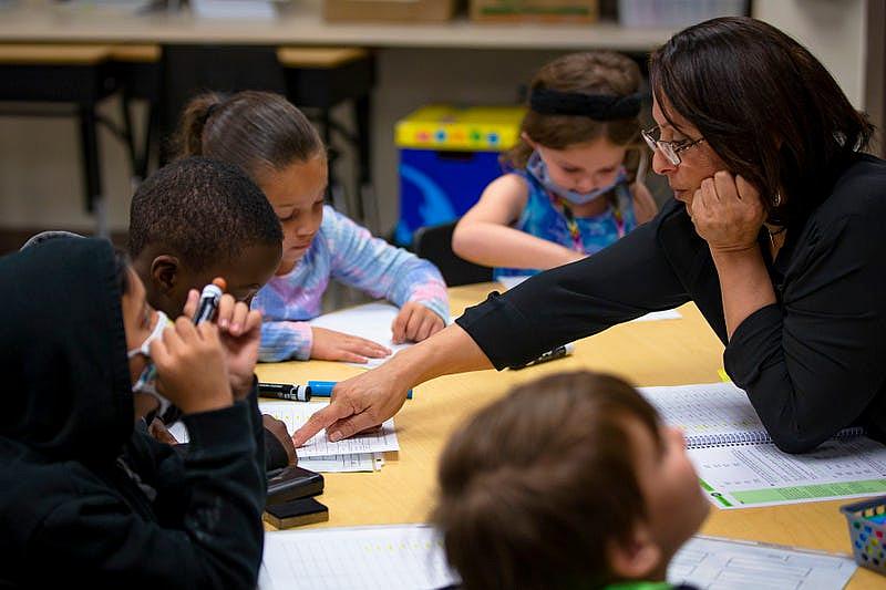 A teacher leads students through an activity at Freedom Elementary School in Buckeye, Arizona in 2021. 
