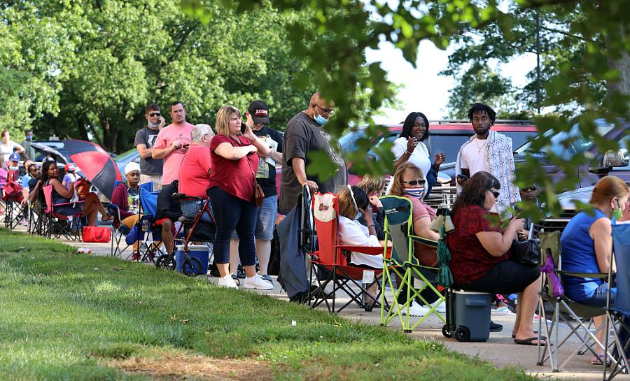 Hundreds of unemployed residents wait in long lines outside the Kentucky Career Center for help with their unemployment claims F