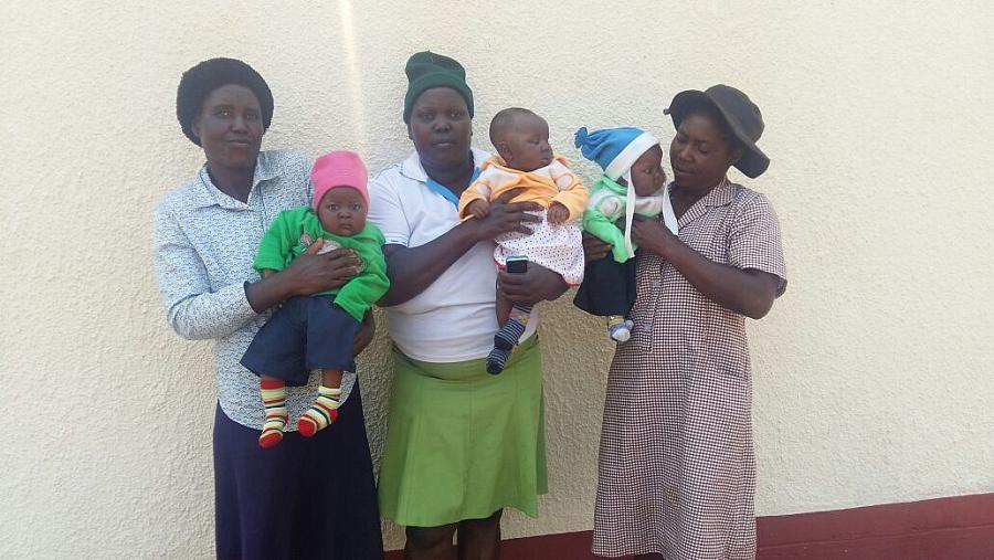 Voiness Nyatsuro in the middle holding her triplets 