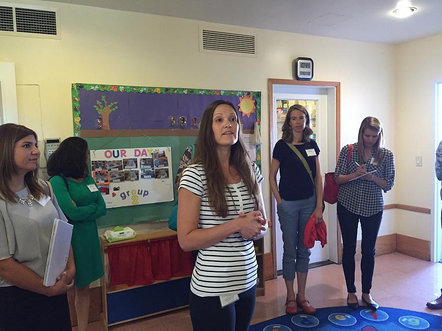 Nicole Fauscette, supervisor of an intensive day treatment program for preschool-aged kids at the Children’s Institute, guides National Health Journalism Fellows on a tour of the center’s Torrance campus.