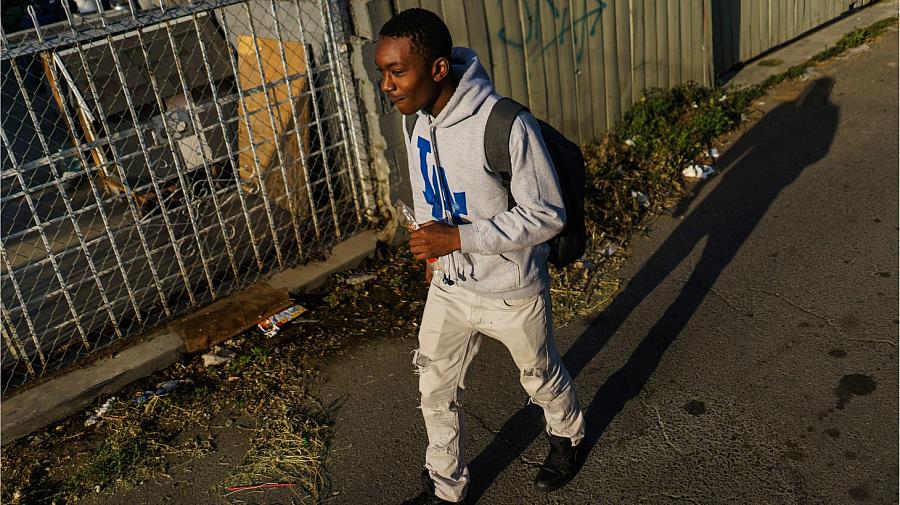 Carl Hull, a 10th grader at Dymally High School, follows a route which he sometimes changes up to get to school.