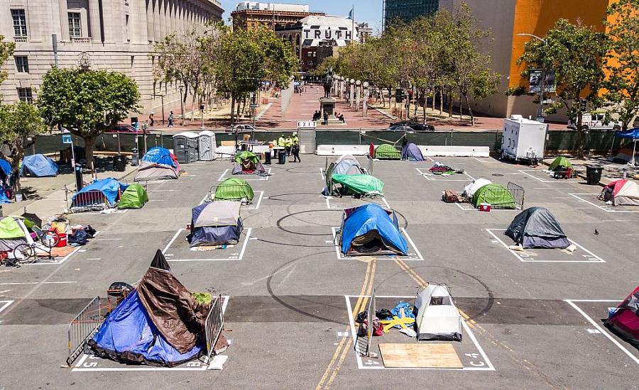 Rectangles painted on the ground to encourage homeless people socially distance at a city-sanctioned homeless encampment 