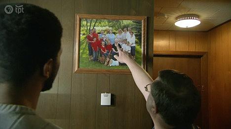 Kevin White points to his mother in a family portrait. Her Medicaid expenses led to a $128,000 lien on his family home, which he