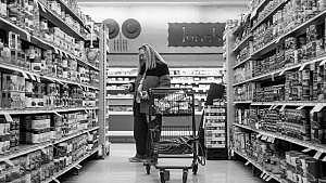 Michele Dutcher takes a bus to and from the Valumarket in Louisville for groceries. (Photo Credit: Matt Stone/Courier Journal)