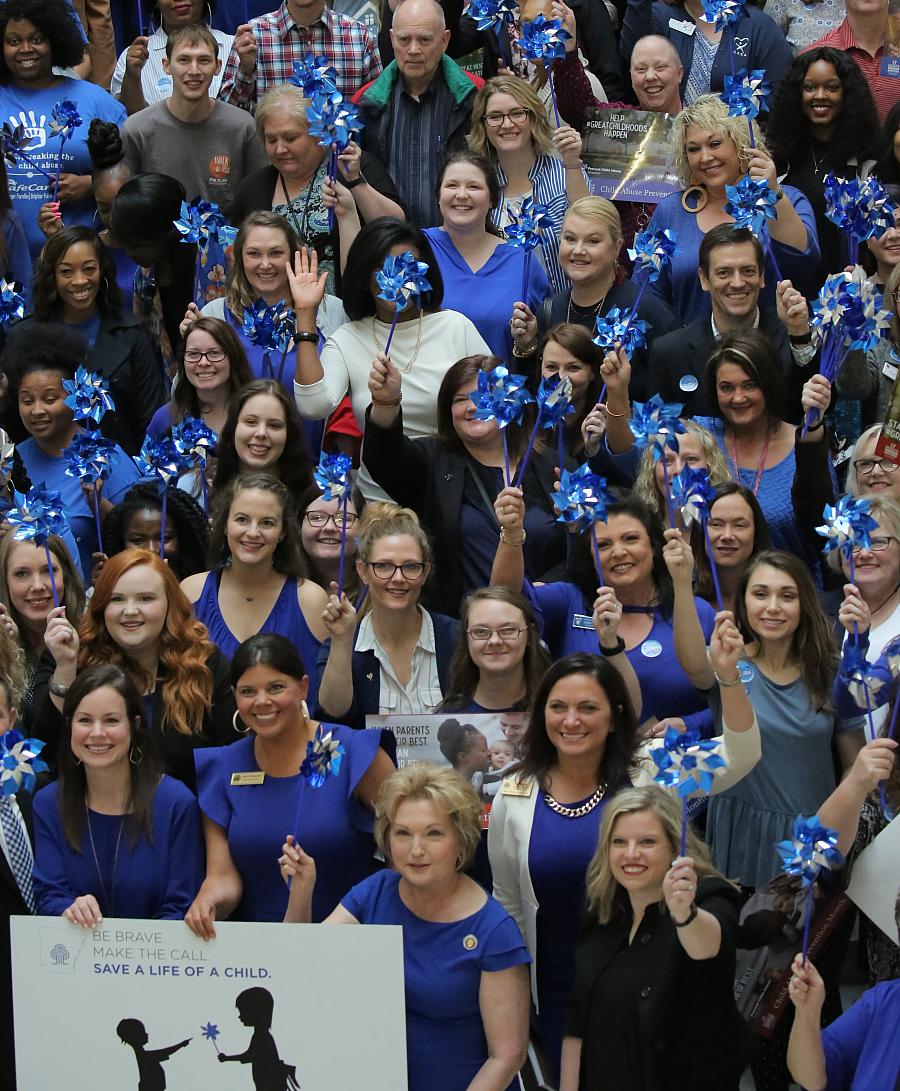 Rally-goers gather at the Arkansas Capitol on April 18, 2019 for an event designed to bring awareness to child abuse.