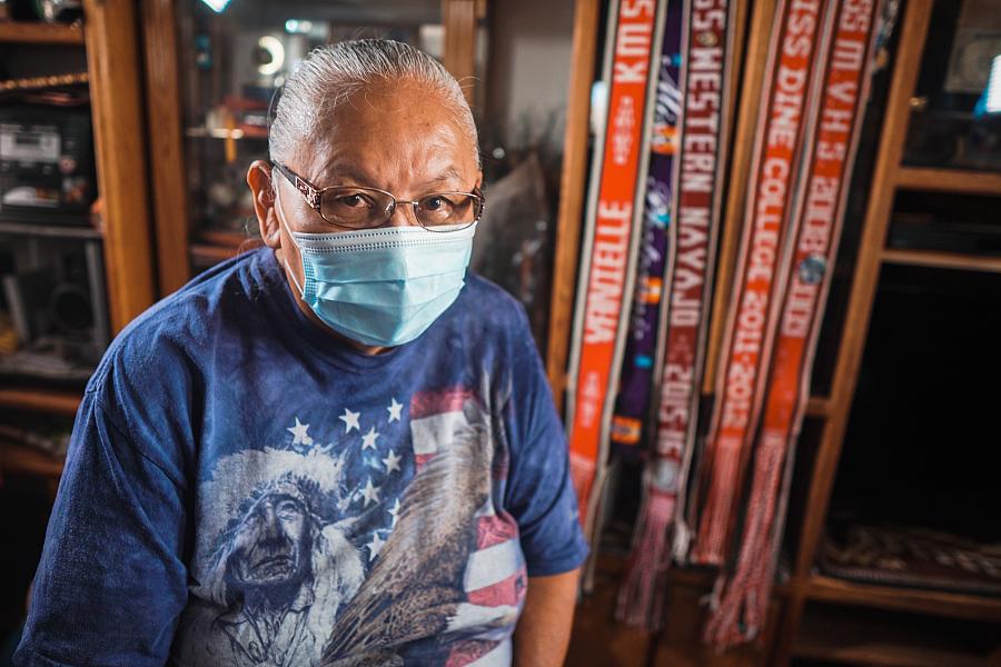 Laverne Blackhorse sits in front of pageant ribbons won by her daughter Valentina, who was one of the first COVID-19 deaths on N