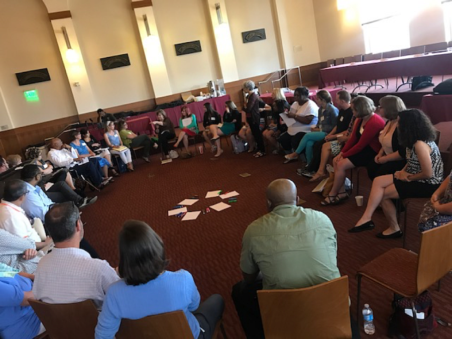 Fellows participate in group discussion in a circle