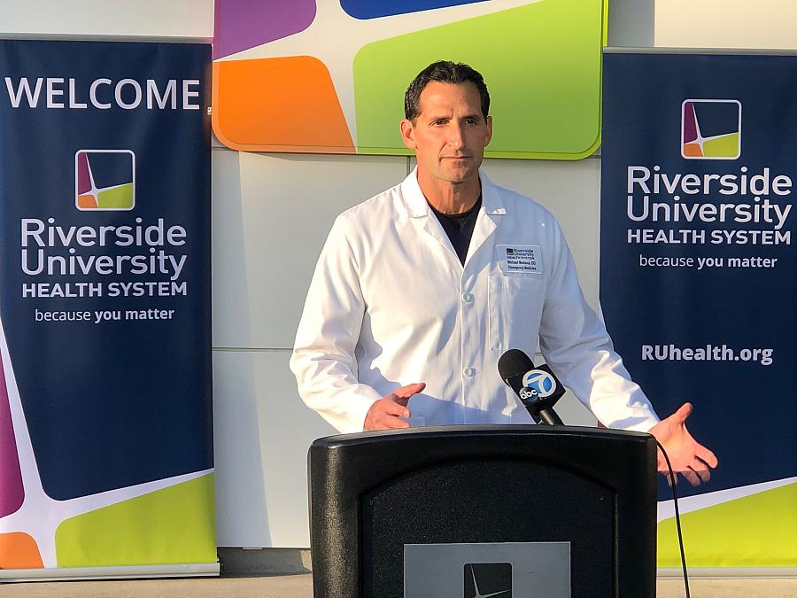 Dr. Michael Mesisca speaks at a news conference during the quarantine at March Air Reserve Base in California's Riverside County