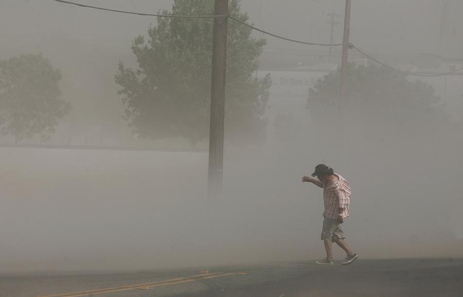 Photo credit: Craig Kohlruss/Fresno Bee: Dust storms like this one that blasted Fresno in June can carry millions of spores fromthe fungus that causes Valley Fever.
