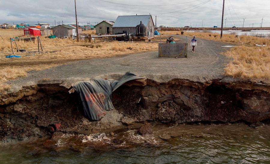 Erosion caused by melting permafrost tundra and the disappearance of sea ice threatens houses from the Yupik Eskimo village