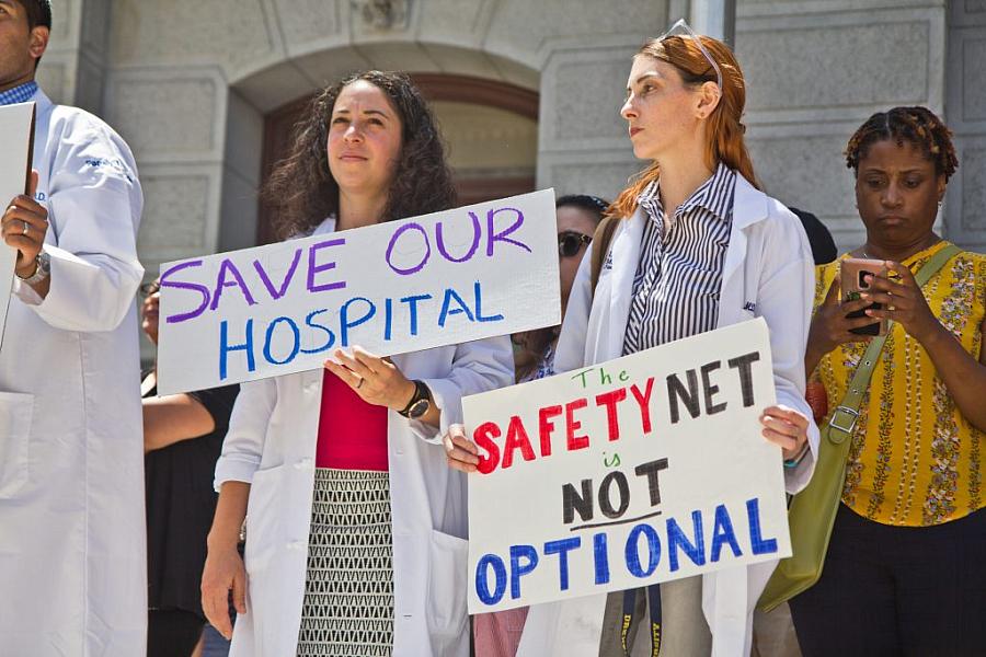 Employees, city officials, and unions rallied against the closing of Hahnemann hospital in Philadelphia in 2019. 