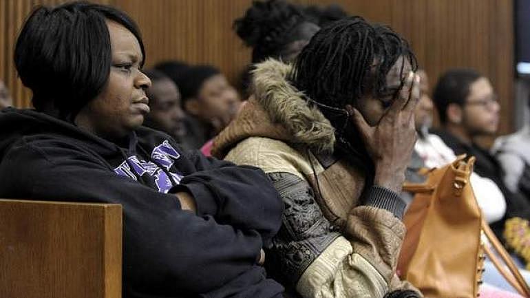 Lyvonne Cargill, left, listens with family members and friends on Thursday at the trial of Chauncey Owens and Charles Jones, who are accused of killing 17-year-old Je'Rean Blake Nobles. (Todd McInturf / The Detroit News)