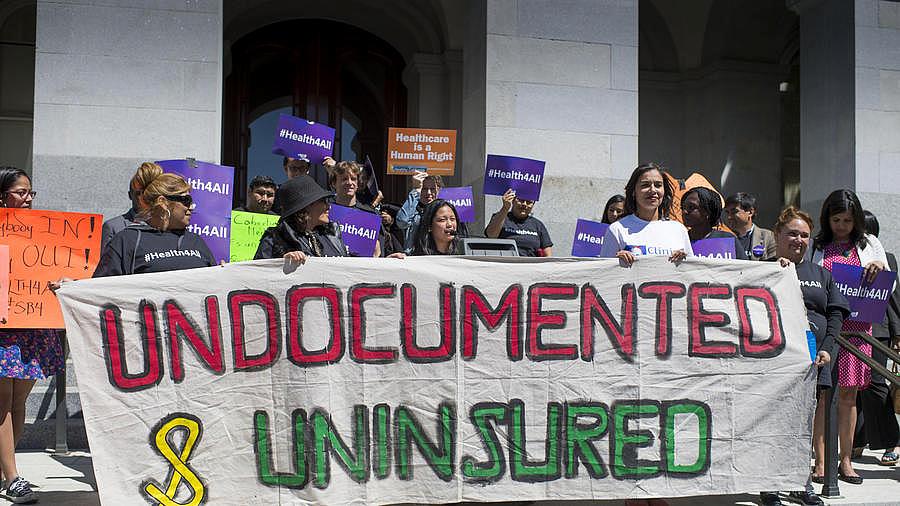Advocates for a bill to provide health care to undocumented immigrants rally in at the Capitol in Sacramento. (Photo by LA Times/Hector Amezcua) Advocates for a bill to provide health care to undocumented immigrants rally in at the Capitol in Sacramento. (Photo by LA Times/Hector Amezcua)