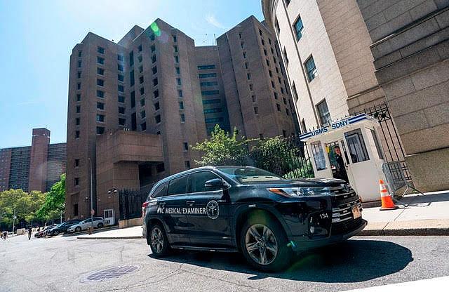 A New York Medical Examiner’s car outside the Metropolitan Correctional Center where financier Jeffrey Epstein was being held wh