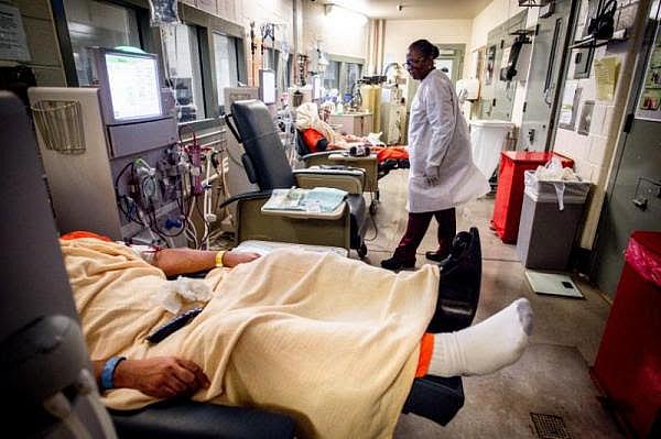 A nurse checks on inmates as they receive dialysis treatment at West Valley Detention Center in San Bernardino County. (Photo by