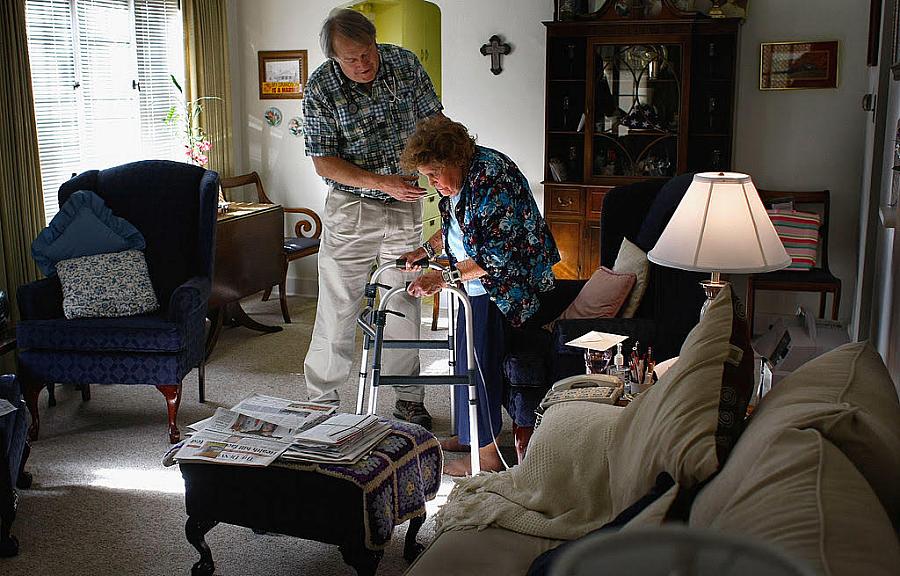 A nurse helps a senior resident with exercises at her Denver home. A local nonprofit provides free home nursing care to patients with chronic diseases, with the aim of keeping patients them out of more expensive nursing homes. Nurse Stephen Van Dyke helps Mary Donahue, 100, with her exercises in her Denver home. A local nonprofit provides free home nurs