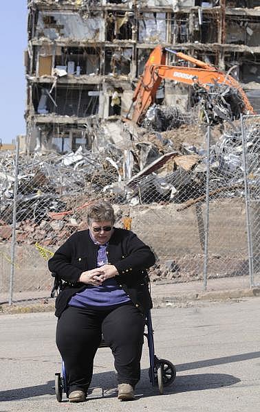 Joanne Schleifer, 58, of Braddock gathers her thoughts during a memorial service for UPMC Braddock in 2011.