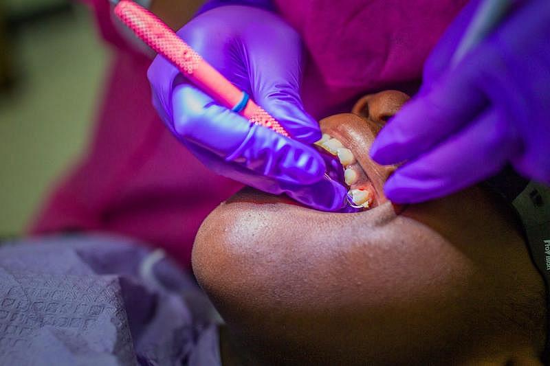 Deitra "DeeDee" Jackson, 11, has her teeth cleaned at the Neighborhood Medical Center located near Rickards High School.