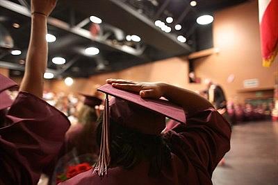 Unyque Jackson leaves the stage at her graduation from High School. Andrew Nixon/Capital Public Radio