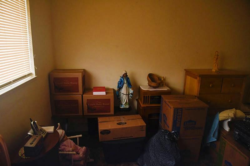 Stacked boxes full of belongings fill the cramped bedroom of Martinez's apartment. Aug. 7, 2020. Ayrtron Ostly/The Californian