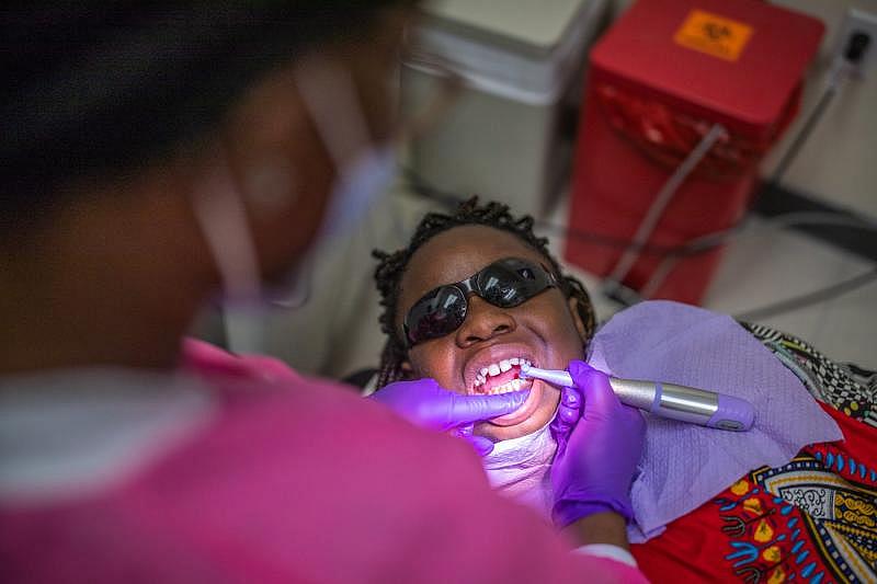 A dental hygienist cleans 11-year-old Deitra "DeeDee" Jackson’s teeth at Neighborhood Medical Center. ALICIA DEVINE/TALLAHASSEE DEMOCRAT
