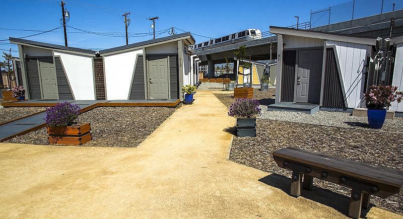 The tiny home community on Mabury Road, near the North San Jose BART station, has 40 cabins with heating and air conditioning. Half the 144 adult residents in the site’s first year have moved into permanent housing, according to HomeFirst Services, the nonprofit agency that runs the site. (Photo: Pamela Gentile)