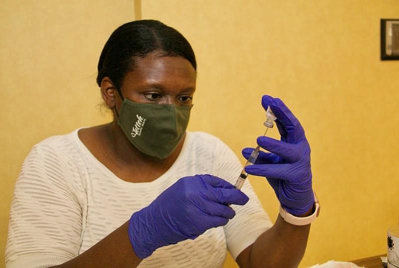 Local pediatrician Dr. Beatrice Tetteh has administered the vaccine to people during pop up and door to door efforts hosted by the Greater Sacramento Urban League. Her doctor’s office in the South Land Park area is also a COVID-19 testing location. Credit: Ray Johnson / OBSERVER