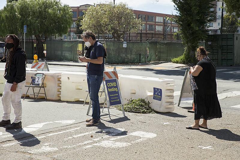 From left, William Palmer, William Beecher and Joline Valenzuela visited the Southeast Health Center in the Bayview District on Aug. 2. (Kevin N. Hume/The Examiner)