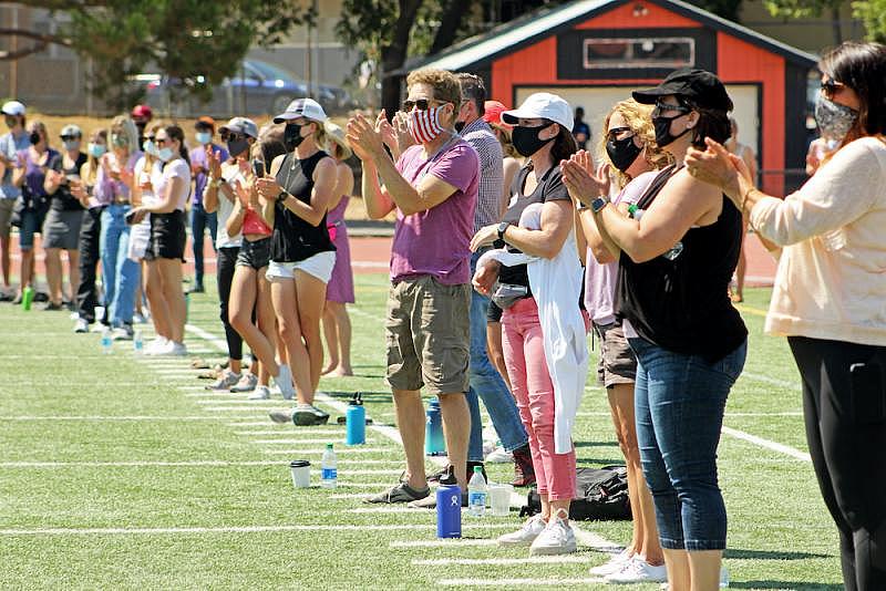 A crowd applauds Mia Lozoya during a rally at the Los Gatos High School field July 2020. (Courtesy of A. Panu)