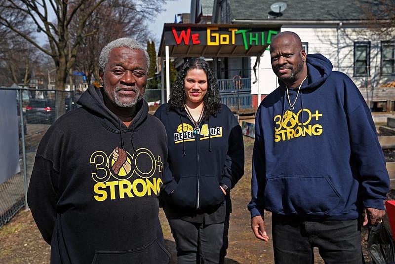Andre Lee Ellis, left, who founded the We Got This garden program, along with Dawn Barnett, co-executive director, and her husband, Victor, executive director of the Running Rebels, gathered in March at the garden at W.Ring and N.9th streets. The two groups have merged. Angela Peterson/Milwaukee Journal Sentinel