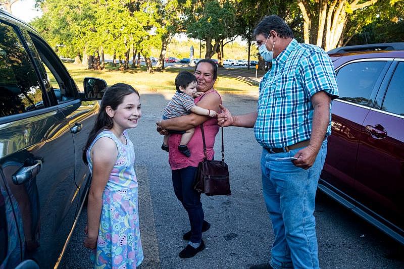 Ruben Acevedo spent time in the hospital with COVID-19. After his vaccine dose, he says hello to friends with his wife. A vaccination clinic targeted to farmworkers was run Wednesday, April 13, 2021, in LaBelle at Family Health Centers of Southwest Florida. Andrea Melendez/ The News-Press/USA Today, Florida Network