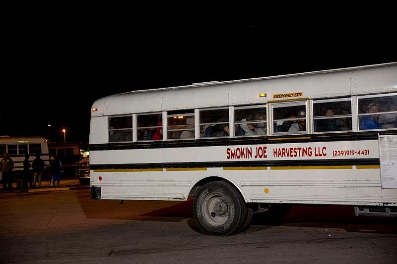 A bus picks up dozens of farmworkers outside of La Fiesta #3 in Immokalee on Friday, April 3, 2020. Alex Driehaus/Naples Daily News/ USA TODAY - FLORIDA NETWORK 