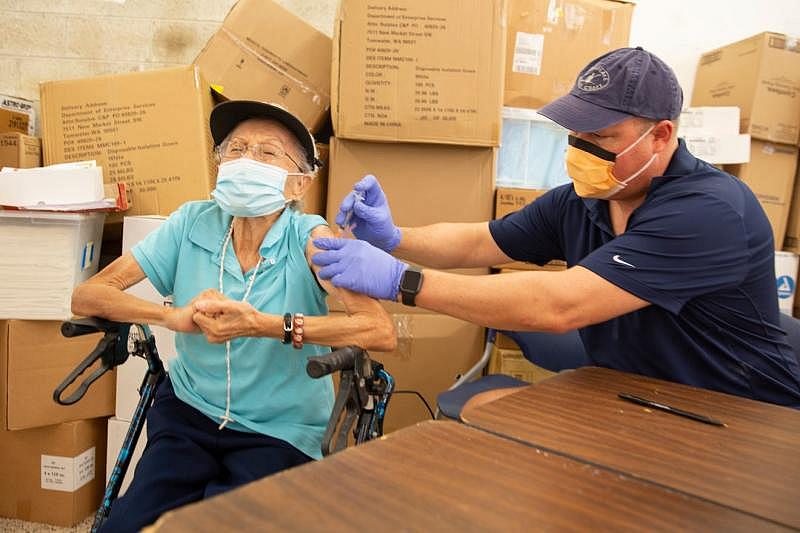 Agnes Barrera, of Immokalee receives her COVID-19 vaccine by Healthcare Network Dr. Douglas Halbert Tuesday Feb. 9, 2021, in Immokalee. Jon Austria /Naples Daily News USA TODAY NETWORK - FLORIDA