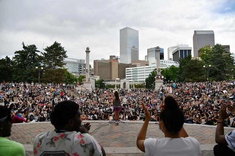 A child speaks to the crowd during a gathering at Civic Center Park in Denver on Thursday, June 4, 2020. Hyoung Chang, The Denver Post