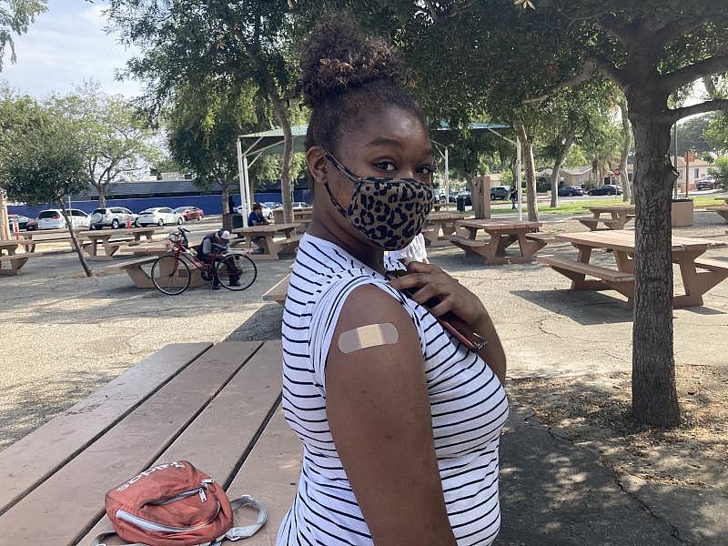 Long Beach resident Kymberli Jenkins, 25, received her first shot of the coronavirus vaccine at Houghton Park on Saturday, July 24, 2021. Photo by Alena Maschke