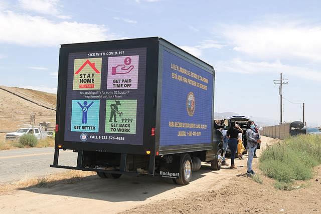 A local labor rights car caravan, stopped on July 28 near a field on Foxen Canyon Road, is led by an LED billboard truck, with screens displaying contact information for state labor agencies and information about workers' rights. Laura Place, Staff A local labor rights car caravan, stopped on July 28 near a field on Foxen Canyon Road, is led by an LED billboard truck, with screens displaying contact information for state labor agencies and information about workers' rights. Laura Place, Staff