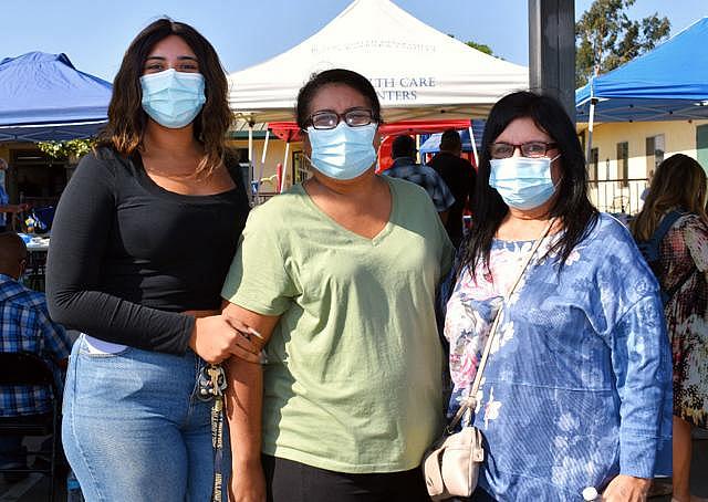 Santa Maria resident Janea Sixto, left, is accompanied by her mother, Lisa Ortiz, center, and her grandmother, Graciela Martinez, as she gets her COVID-19 vaccine on Sept. 15 in Santa Maria. After the three contracted COVID-19 in August, leading Martinez to be hospitalized, they decided it was time to get the shot.  Randy De La Peña, Contributor