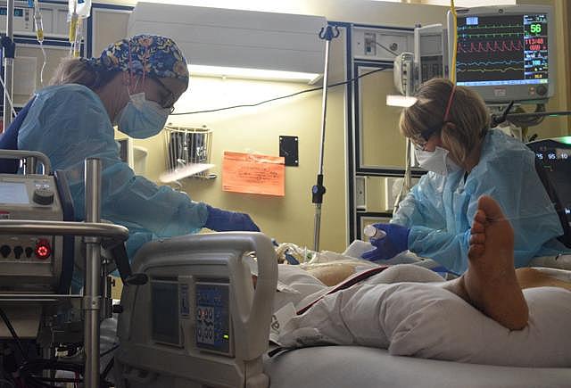 Registered nurses Karen Miner, left, and Dana List check on a COVID-19 patient in Marian Regional Medical Center's critical care unit on Sept. 9. Randy De La Peña, Contributor Registered nurses Karen Miner, left, and Dana List check on a COVID-19 patient in Marian Regional Medical Center's critical care unit on Sept. 9. Randy De La Peña, Contributor