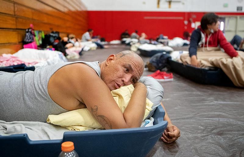 Johnny Alvarez, 47, rests inside the emergency overnight shelter run by the Coachella Valley Rescue Mission inside a portion of the Palm Springs High School Gymnasium on Saturday , June 27, 2020. Taya Gray, Taya Gray
