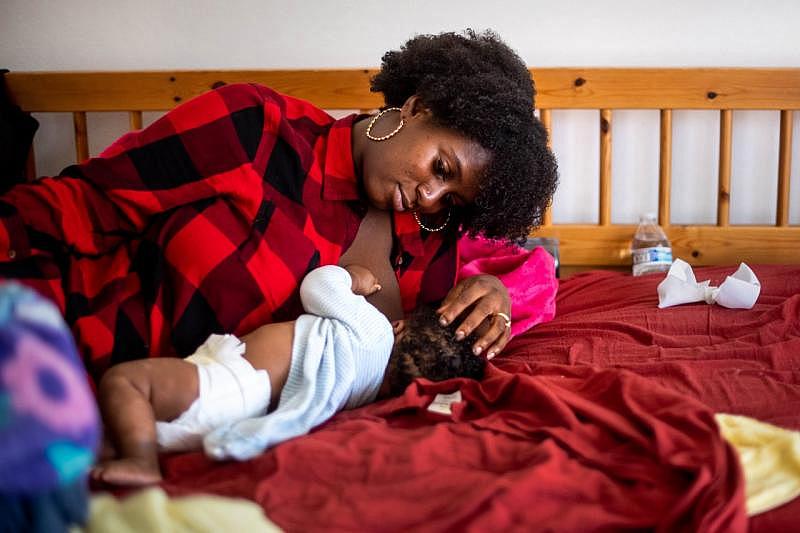 Aysha nurses three-month-old Nikko after he wakes from a nap at their home in downtown LA on Tuesday, August 10, 2021. (Photo by Sarah Reingewirtz, Los Angeles Daily News/SCNG)