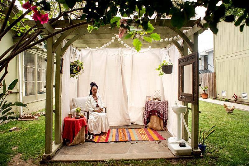 Midwife Racha Tahani Lawler sits in the space in her garden on Tuesday, July 6, 2021, where she meets with women. She once owned a community birth center but, without insurance covering midwifery, found it to be difficult to sustain and now does home births. (Photo by Sarah Reingewirtz, Los Angeles Daily News/SCNG)