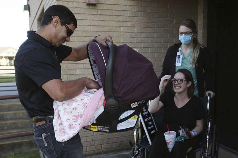 Thirty-nine hours after arriving at the hospital, Alex held Luna for the first time. (Jerry Lara | Express News)