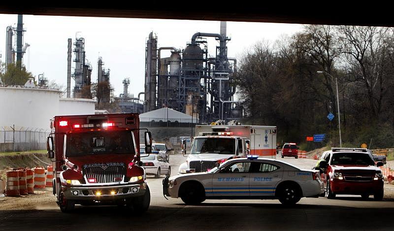 March 6, 2012 - A pair of ambulances pull out of the Valero oil refinery on Mallory following an explosion at the plant that... THE COMMERCIAL APPEAL FILE PHOTO