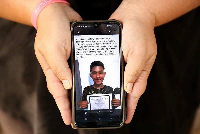 Winters shows a photo of her son, Jahheen, graduating middle school. DOUGLAS R. CLIFFORD | Times