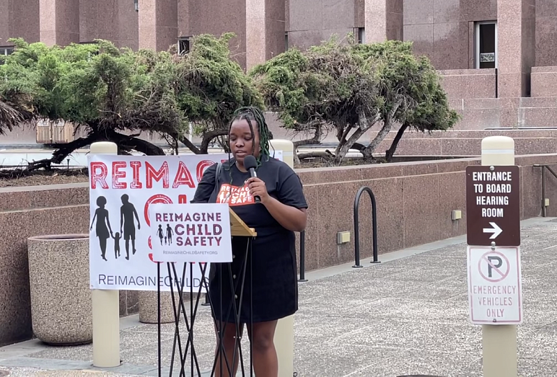 Photo: Tauheedah Shakur shares her story at the Reimagine Child Safety Coalition rally.
