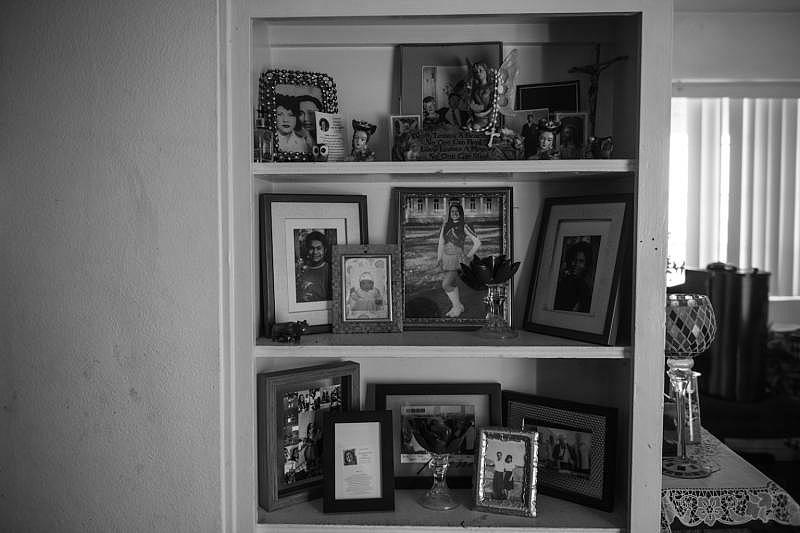 Family pictures adorn the living room of Christina Gomez’s daughter’s home in Wilmington, California. Pablo Unzueta